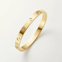 18K gold plated screw bangle gold stainless steel UAE Jewelique